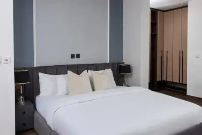 Main bedroom at Magnolia with a king bed and full-height wardrobes